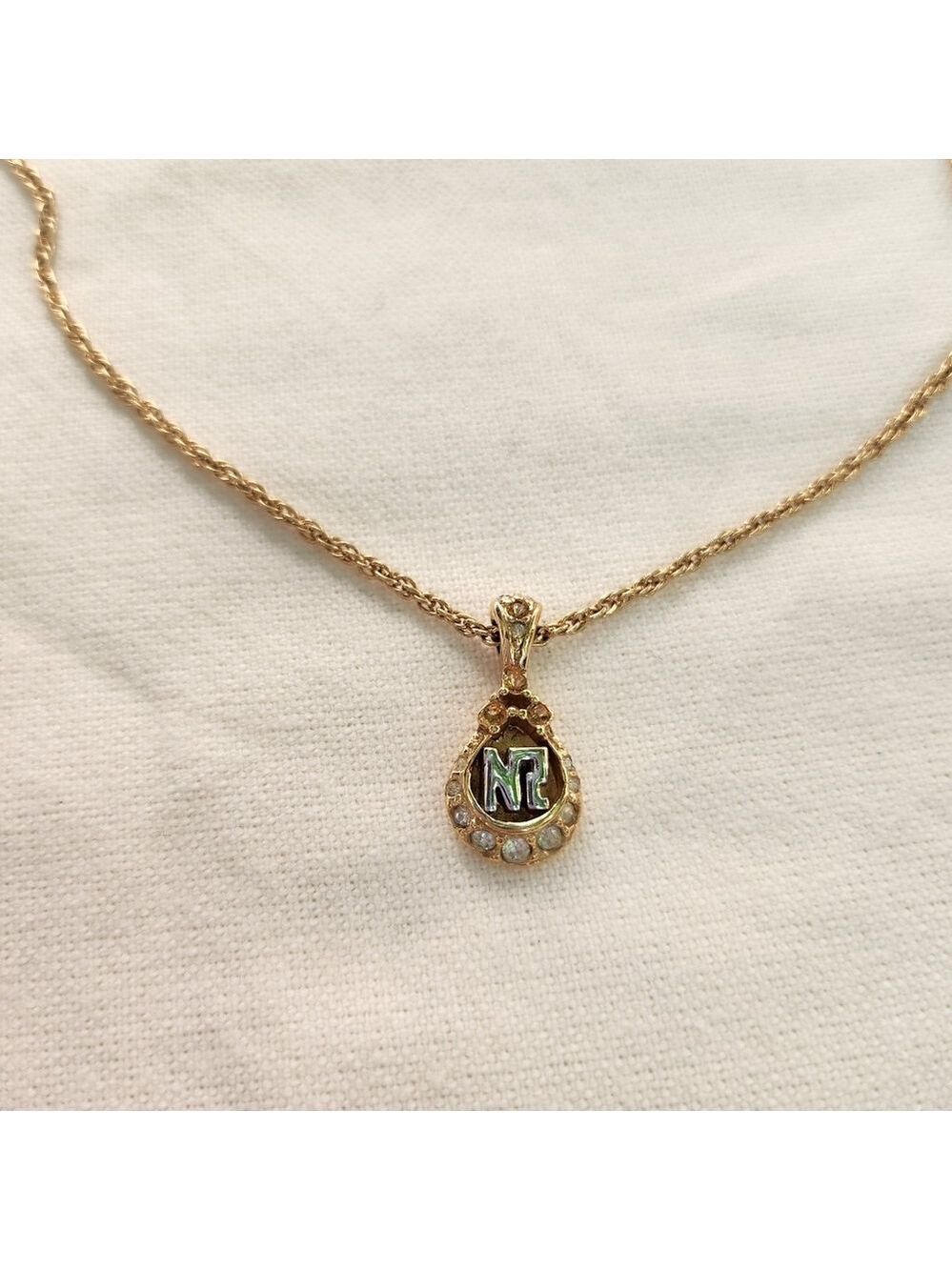 Nina Ricci Gold Tone Rhinestone pendant signed